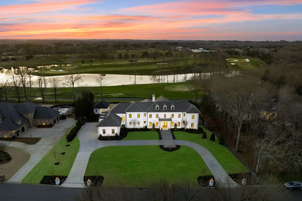 7214 Baltusrol Lane Home in Charlotte, North Carolina. Discover unparalleled luxury living at "Satisfaction In Charlotte," a meticulously renovated estate offering breathtaking views of Quail Hollow's premier golf course. This turn-key home boasts top-to-bottom renovations by Peters Custom Homes, including a culinary masterpiece kitchen, indulgent primary suite with private balcony, and seamless indoor-outdoor living spaces perfect for entertaining.
