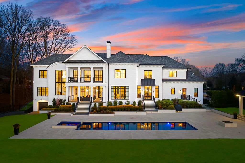 7214 Baltusrol Lane Home in Charlotte, North Carolina. Discover unparalleled luxury living at "Satisfaction In Charlotte," a meticulously renovated estate offering breathtaking views of Quail Hollow's premier golf course. This turn-key home boasts top-to-bottom renovations by Peters Custom Homes, including a culinary masterpiece kitchen, indulgent primary suite with private balcony, and seamless indoor-outdoor living spaces perfect for entertaining.