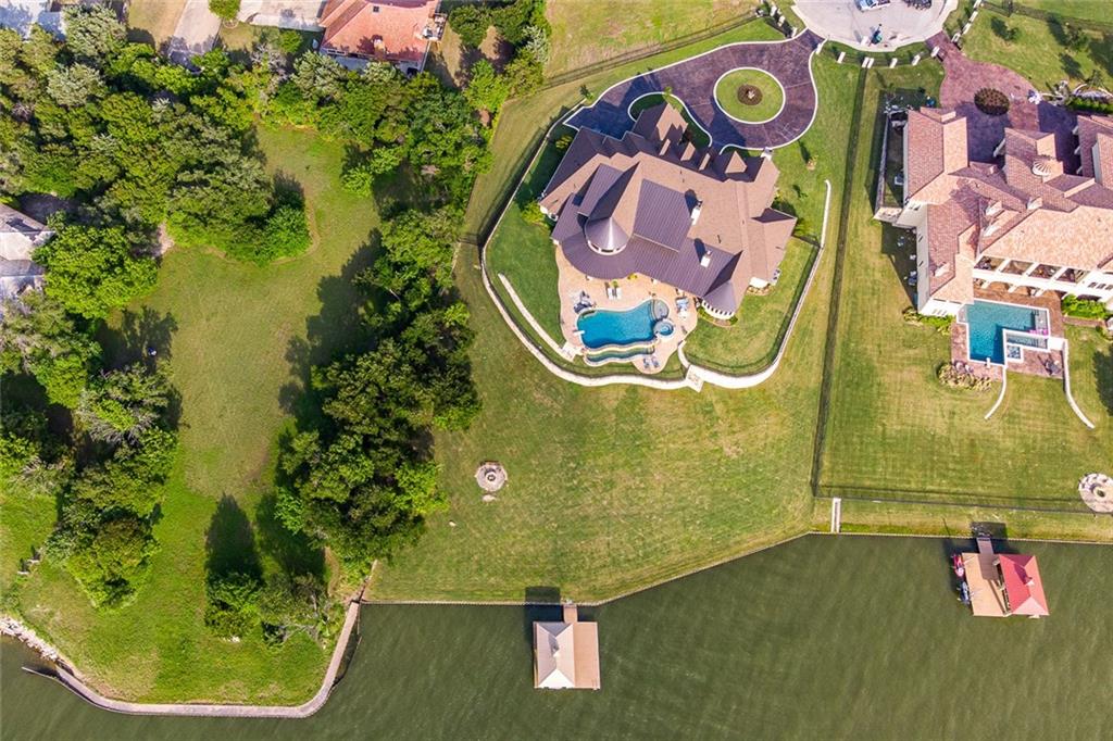916 Cedar Shores Drive Home in Heath, Texas. Explore the epitome of luxury at Sunset Shores, a stunning estate situated on a picturesque 1.5-acre waterfront lot on Lake Ray Hubbard.