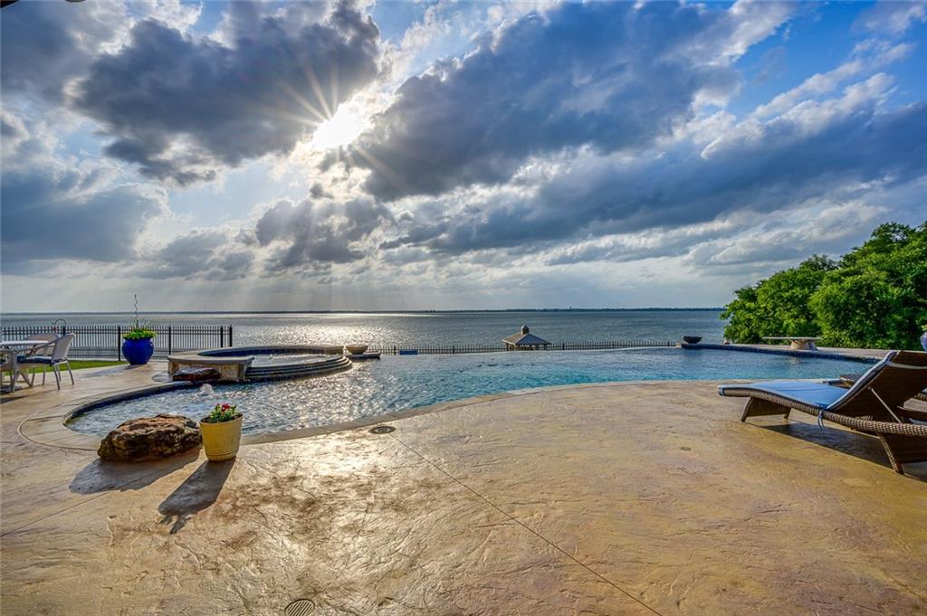 916 Cedar Shores Drive Home in Heath, Texas. Explore the epitome of luxury at Sunset Shores, a stunning estate situated on a picturesque 1.5-acre waterfront lot on Lake Ray Hubbard.
