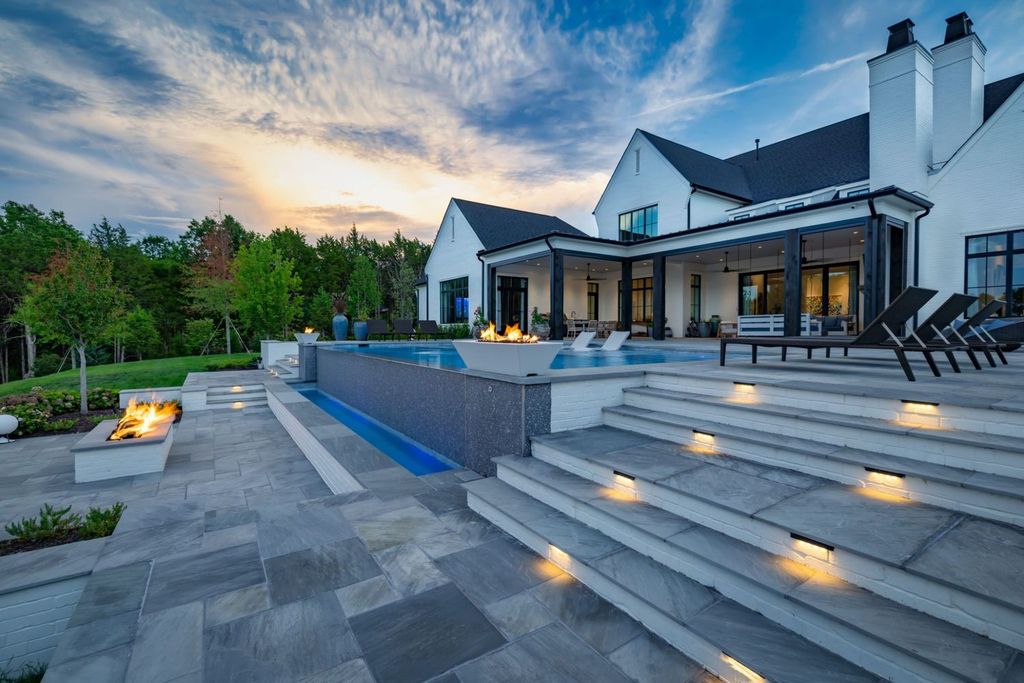 9252 Lehigh Drive Home in Brentwood, Tennessee. Step into luxury living at its finest with this stunning transitional home nestled on a private 3.5-acre lot in Brentwood. Enjoy breathtaking views of the surrounding hillsides from every angle, complemented by Marie-Joe Bouffard’s captivating interior design. 