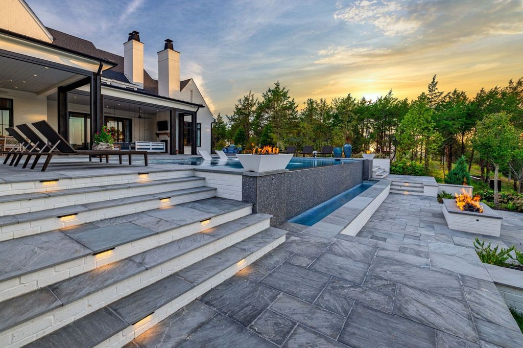 9252 Lehigh Drive Home in Brentwood, Tennessee. Step into luxury living at its finest with this stunning transitional home nestled on a private 3.5-acre lot in Brentwood. Enjoy breathtaking views of the surrounding hillsides from every angle, complemented by Marie-Joe Bouffard’s captivating interior design. 