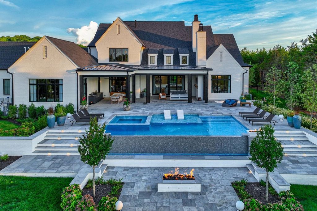 9252 Lehigh Drive Home in Brentwood, Tennessee. Step into luxury living at its finest with this stunning transitional home nestled on a private 3.5-acre lot in Brentwood. Enjoy breathtaking views of the surrounding hillsides from every angle, complemented by Marie-Joe Bouffard’s captivating interior design. 