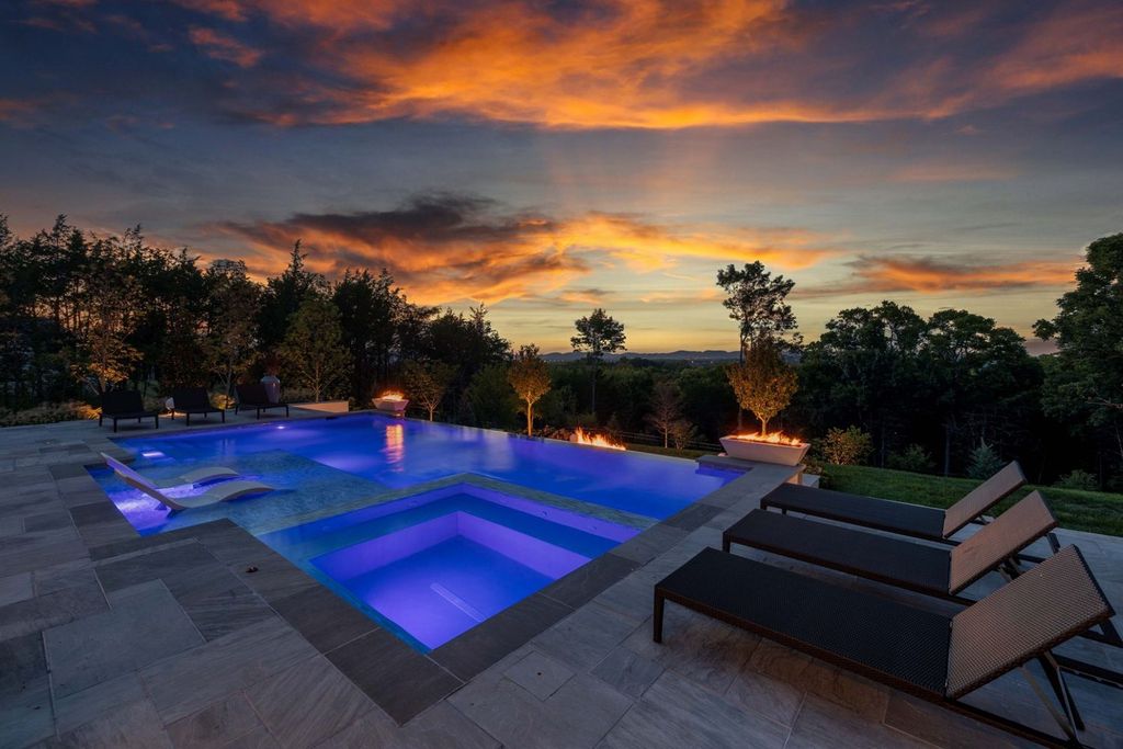 9252 Lehigh Drive Home in Brentwood, Tennessee. Step into luxury living at its finest with this stunning transitional home nestled on a private 3.5-acre lot in Brentwood. Enjoy breathtaking views of the surrounding hillsides from every angle, complemented by Marie-Joe Bouffard’s captivating interior design. 
