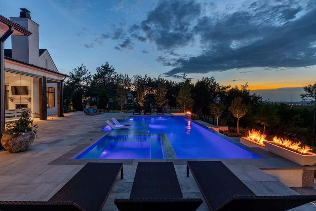 9252 Lehigh Drive Home in Brentwood, Tennessee. Step into luxury living at its finest with this stunning transitional home nestled on a private 3.5-acre lot in Brentwood. Enjoy breathtaking views of the surrounding hillsides from every angle, complemented by Marie-Joe Bouffard’s captivating interior design. 