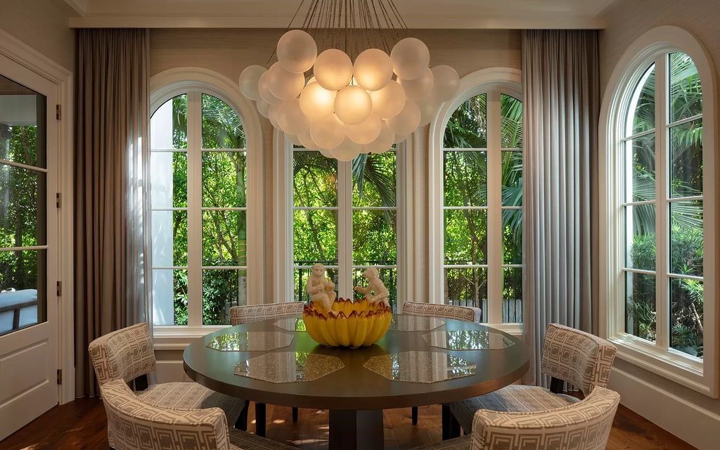 Discover luxury living at 323 Chilean Avenue, an impeccably re-imagined masterpiece in the tranquil heart of Palm Beach Town.