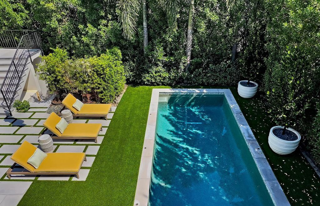 Discover luxury living at 323 Chilean Avenue, an impeccably re-imagined masterpiece in the tranquil heart of Palm Beach Town.