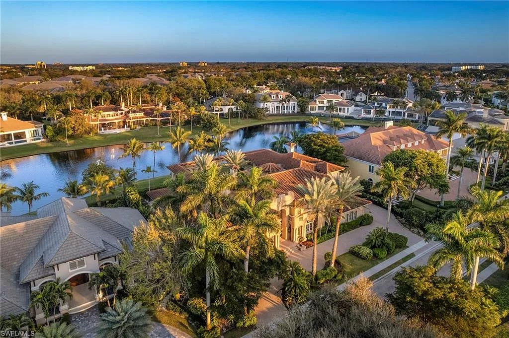 Welcome to the epitome of luxury living at 7310 Tilden Ln in Bay Colony Shores, Naples, Florida. This magnificent estate boasts over 10,000 square feet of meticulously crafted living space, featuring 6 palatial bedrooms with en-suite bathrooms, two additional half baths, and exquisite architectural details throughout.