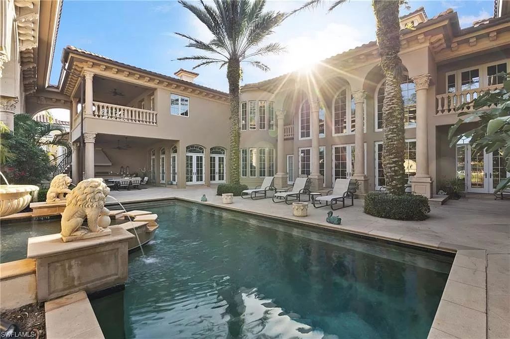 Welcome to the epitome of luxury living at 7310 Tilden Ln in Bay Colony Shores, Naples, Florida. This magnificent estate boasts over 10,000 square feet of meticulously crafted living space, featuring 6 palatial bedrooms with en-suite bathrooms, two additional half baths, and exquisite architectural details throughout.