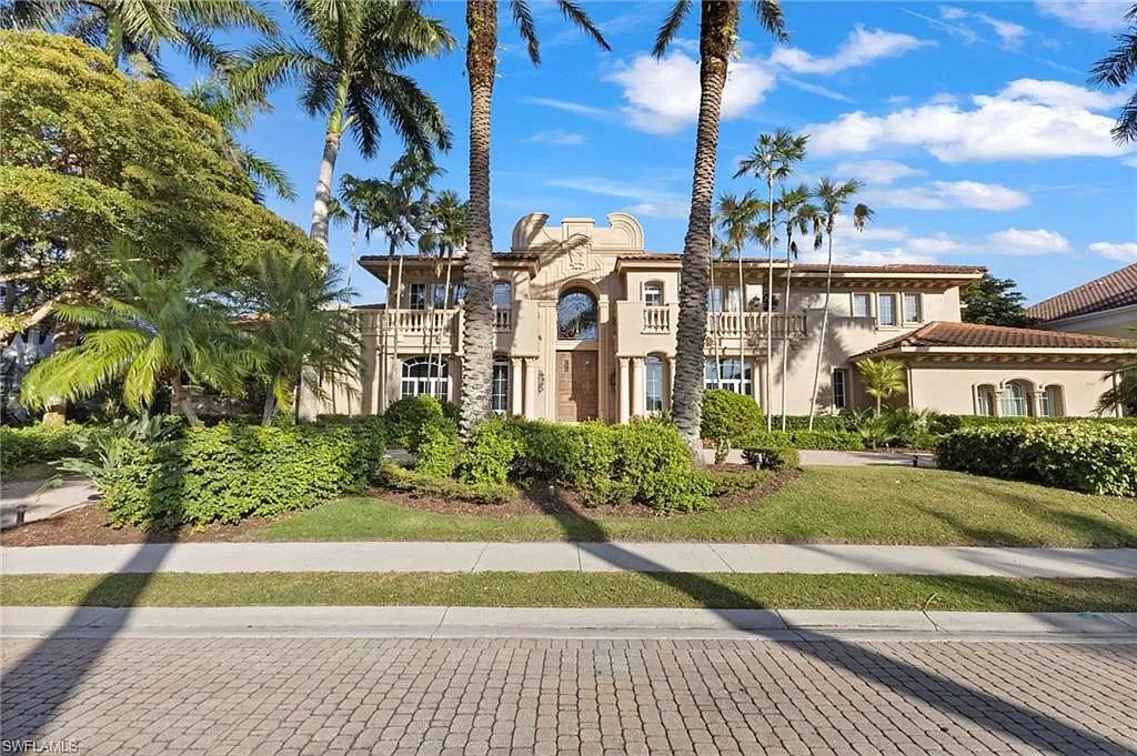 Welcome to the epitome of luxury living at 7310 Tilden Ln in Bay Colony Shores, Naples, Florida. This magnificent estate boasts over 10,000 square feet of meticulously crafted living space, featuring 6 palatial bedrooms with en-suite bathrooms, two additional half baths, and exquisite architectural details throughout.