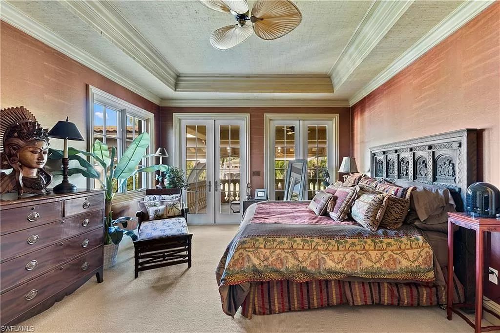 Welcome to the epitome of luxury living at 7310 Tilden Ln in Bay Colony Shores, Naples, Florida. This magnificent estate boasts over 10,000 square feet of meticulously crafted living space, featuring 6 palatial bedrooms with en-suite bathrooms, two additional half baths, and exquisite architectural details throughout.