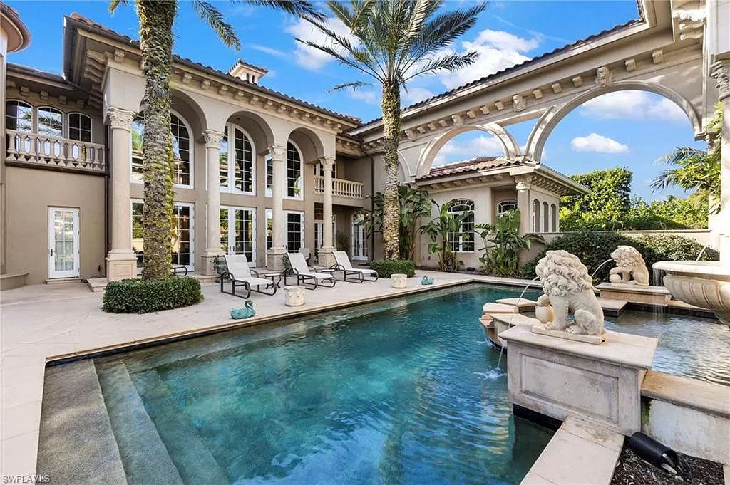 Welcome to the epitome of luxury living at 7310 Tilden Ln in Bay Colony Shores, Naples, Florida. This magnificent estate boasts over 10,000 square feet of meticulously crafted living space, featuring 6 palatial bedrooms with en-suite bathrooms, two additional half baths, and exquisite architectural details throughout.