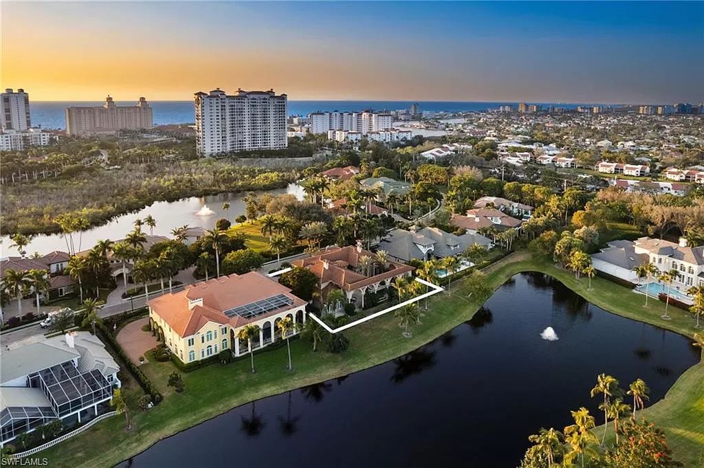 Welcome to the epitome of luxury living at 7310 Tilden Ln in Bay Colony Shores, Naples, Florida. This magnificent estate boasts over 10,000 square feet of meticulously crafted living space, featuring 6 palatial bedrooms with en-suite bathrooms, two additional half baths, and exquisite architectural details throughout.