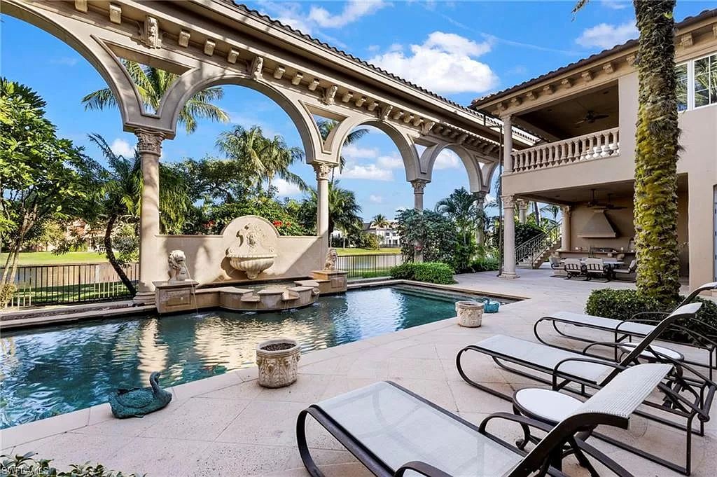 Welcome to the epitome of luxury living at 7310 Tilden Ln in Bay Colony Shores, Naples, Florida. This magnificent estate boasts over 10,000 square feet of meticulously crafted living space, featuring 6 palatial bedrooms with en-suite bathrooms, two additional half baths, and exquisite architectural details throughout.
