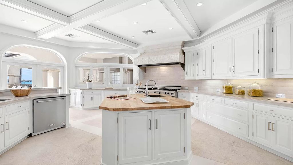 Discover an unparalleled opportunity in South Florida with this magnificent estate boasting nearly 4 acres of prime coastline, featuring 350 feet of direct Intracoastal waterfrontage and an additional 350 feet of direct oceanfrontage.