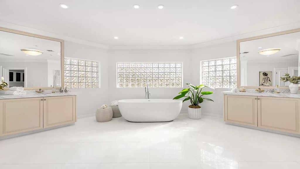 Discover an unparalleled opportunity in South Florida with this magnificent estate boasting nearly 4 acres of prime coastline, featuring 350 feet of direct Intracoastal waterfrontage and an additional 350 feet of direct oceanfrontage.