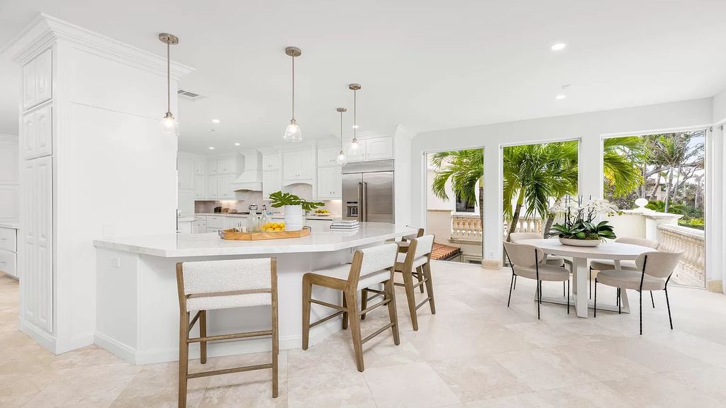 Presenting an extraordinary opportunity along 1840 S Ocean Blvd in Manalapan, Florida, this recently updated Ocean-to-Intracoastal compound offers luxurious waterfront living on nearly two acres of prime real estate.