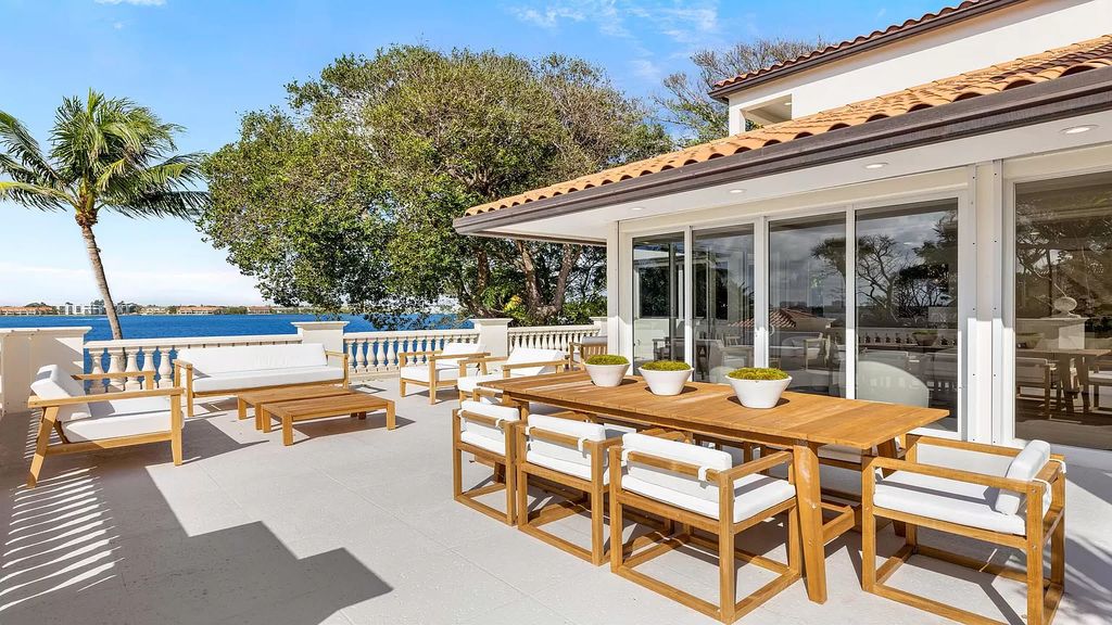 Presenting an extraordinary opportunity along 1840 S Ocean Blvd in Manalapan, Florida, this recently updated Ocean-to-Intracoastal compound offers luxurious waterfront living on nearly two acres of prime real estate.