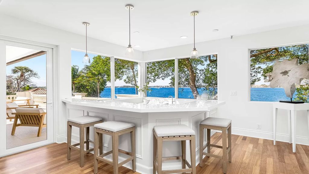 Presenting an extraordinary opportunity along 1840 S Ocean Blvd in Manalapan, Florida, this recently updated Ocean-to-Intracoastal compound offers luxurious waterfront living on nearly two acres of prime real estate.