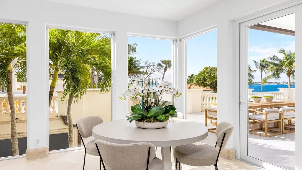 Presenting an extraordinary opportunity along 1840 S Ocean Blvd in Manalapan, Florida, this recently updated Ocean-to-Intracoastal compound offers luxurious waterfront living on nearly two acres of prime real estate.