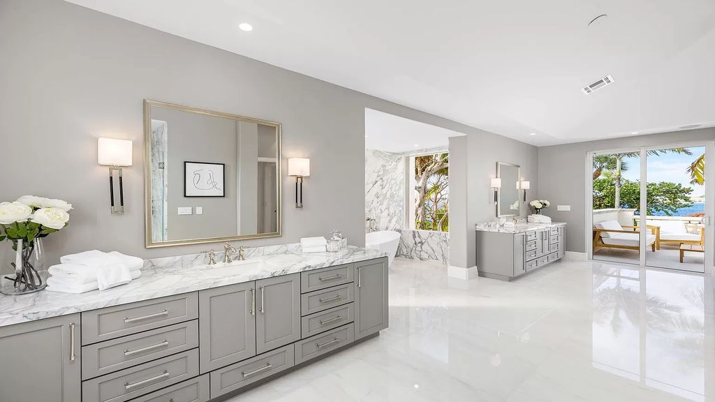 Presenting an extraordinary opportunity along 1840 S Ocean Blvd in Manalapan, Florida, this recently updated Ocean-to-Intracoastal compound offers luxurious waterfront living on nearly two acres of prime real estate.