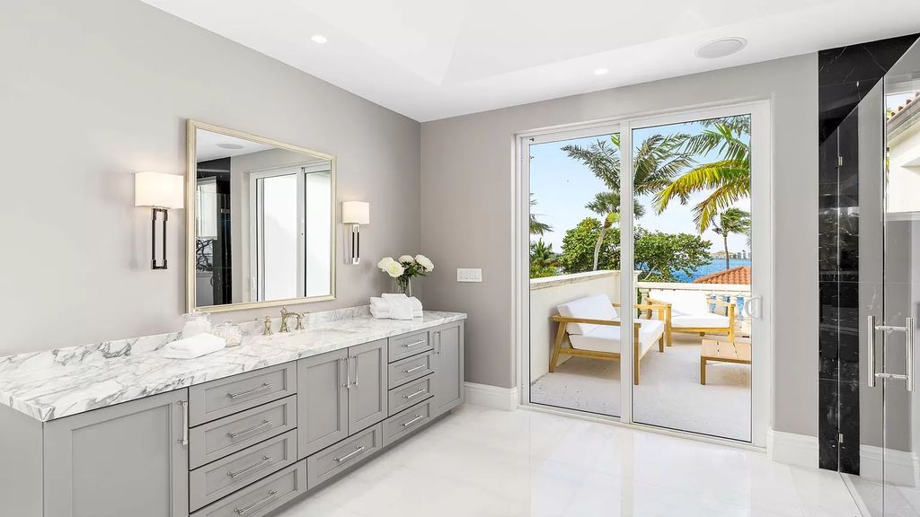 Presenting an extraordinary opportunity along 1840 S Ocean Blvd in Manalapan, Florida, this recently updated Ocean-to-Intracoastal compound offers luxurious waterfront living on nearly two acres of prime real estate.