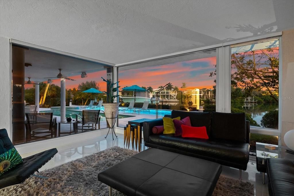 Nestled along the serene shores of Cocoanut Bayou, this captivating 4-bedroom, 4-bathroom sanctuary offers an unparalleled lifestyle for sailboat enthusiasts, boasting two boat lifts and panoramic water views.