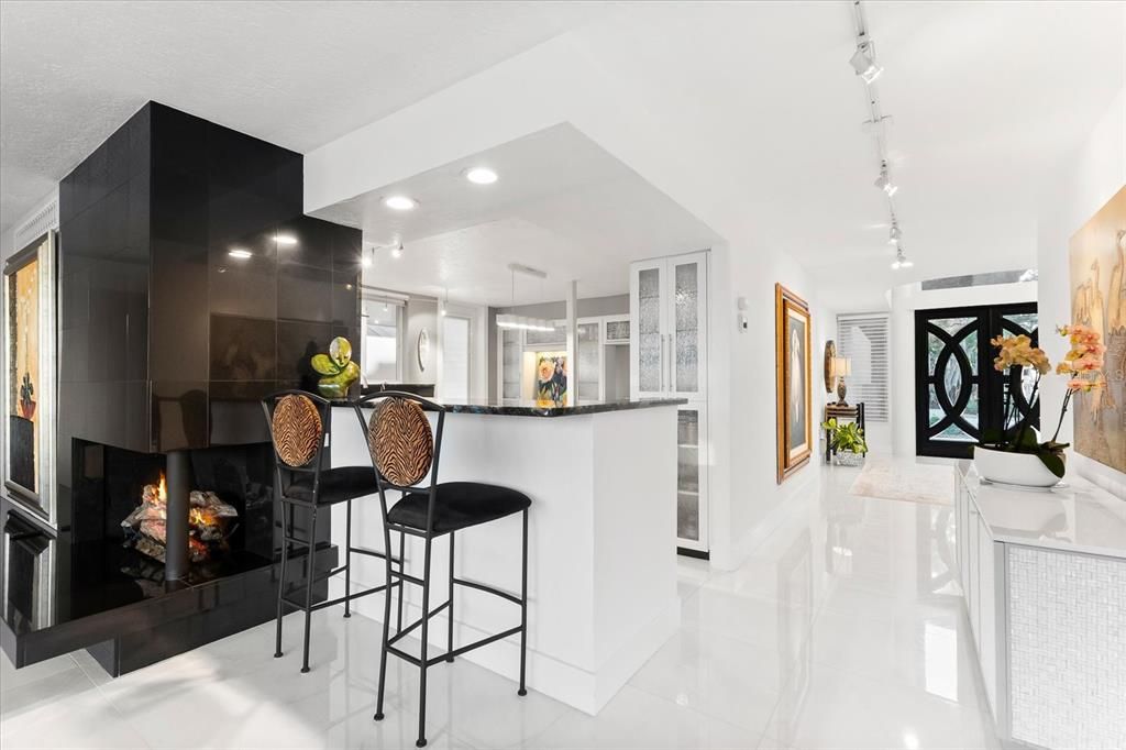 Nestled along the serene shores of Cocoanut Bayou, this captivating 4-bedroom, 4-bathroom sanctuary offers an unparalleled lifestyle for sailboat enthusiasts, boasting two boat lifts and panoramic water views.