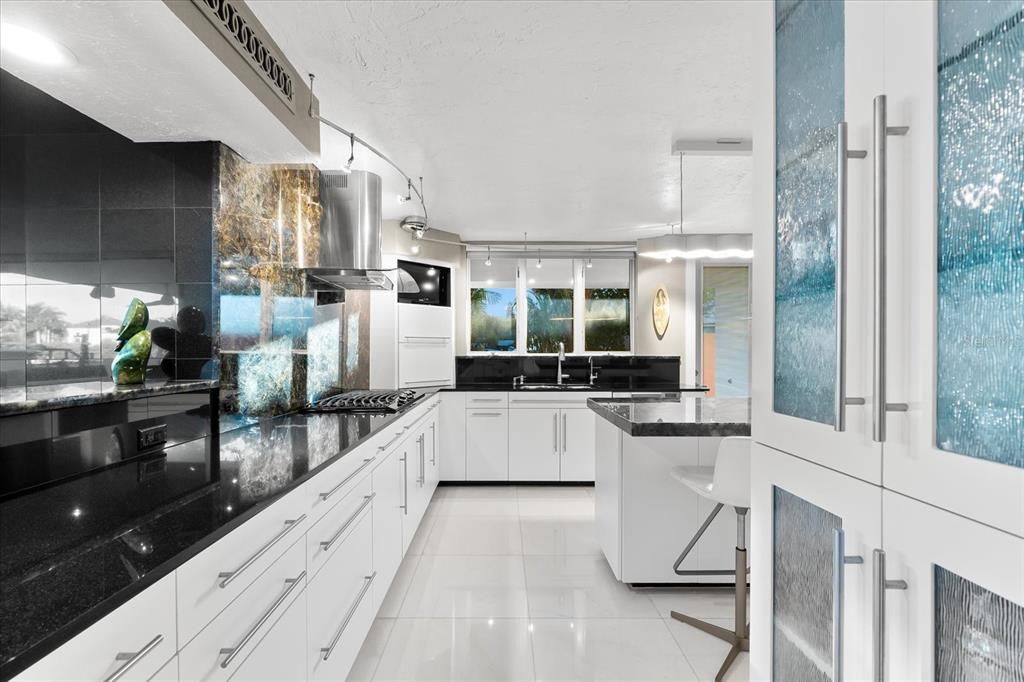Nestled along the serene shores of Cocoanut Bayou, this captivating 4-bedroom, 4-bathroom sanctuary offers an unparalleled lifestyle for sailboat enthusiasts, boasting two boat lifts and panoramic water views.