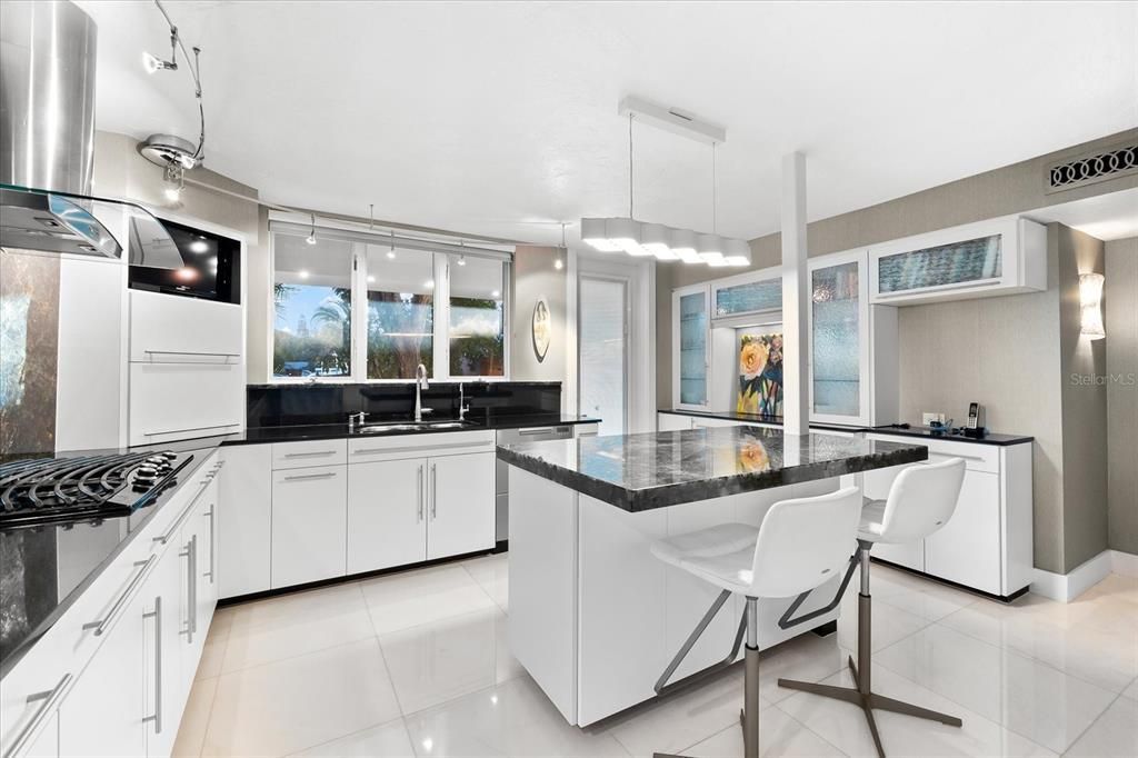 Nestled along the serene shores of Cocoanut Bayou, this captivating 4-bedroom, 4-bathroom sanctuary offers an unparalleled lifestyle for sailboat enthusiasts, boasting two boat lifts and panoramic water views.