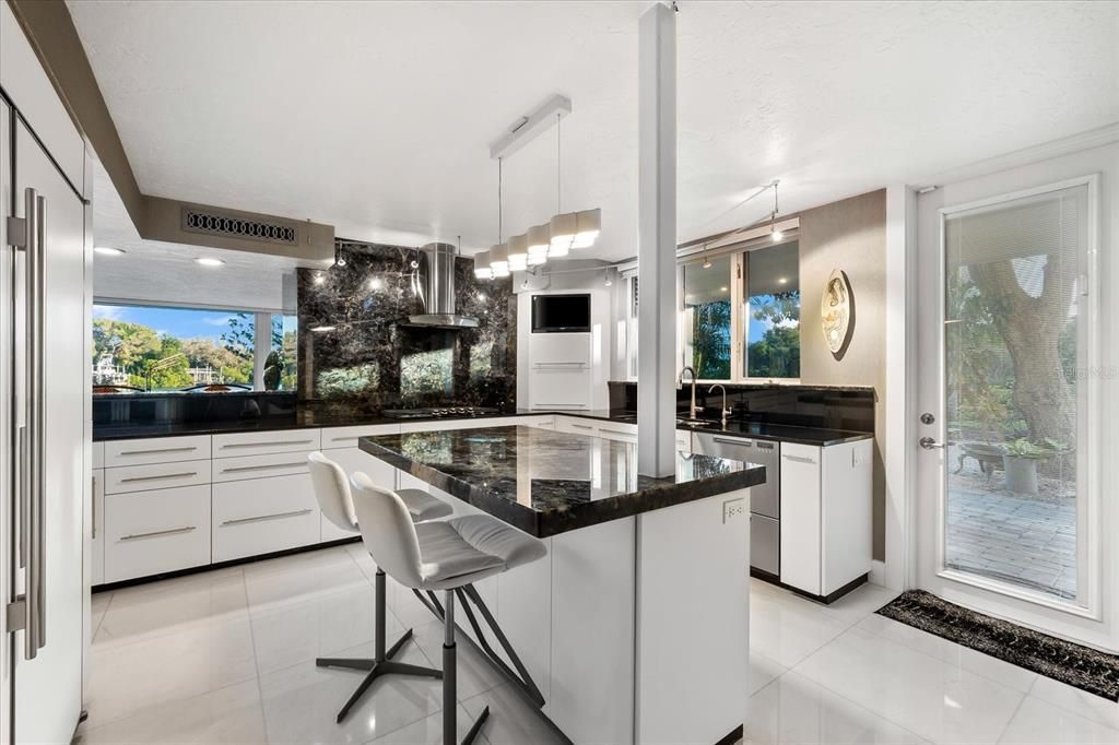 Nestled along the serene shores of Cocoanut Bayou, this captivating 4-bedroom, 4-bathroom sanctuary offers an unparalleled lifestyle for sailboat enthusiasts, boasting two boat lifts and panoramic water views.