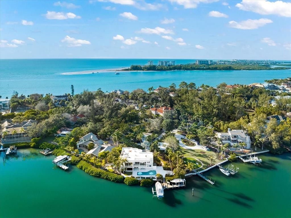 Nestled along the serene shores of Cocoanut Bayou, this captivating 4-bedroom, 4-bathroom sanctuary offers an unparalleled lifestyle for sailboat enthusiasts, boasting two boat lifts and panoramic water views.