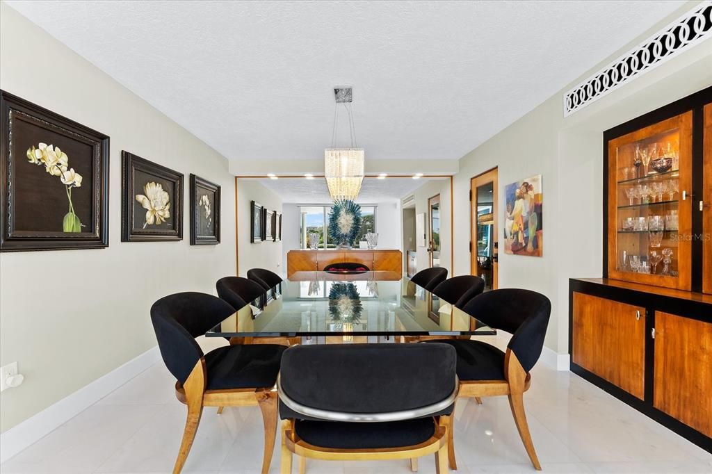 Nestled along the serene shores of Cocoanut Bayou, this captivating 4-bedroom, 4-bathroom sanctuary offers an unparalleled lifestyle for sailboat enthusiasts, boasting two boat lifts and panoramic water views.