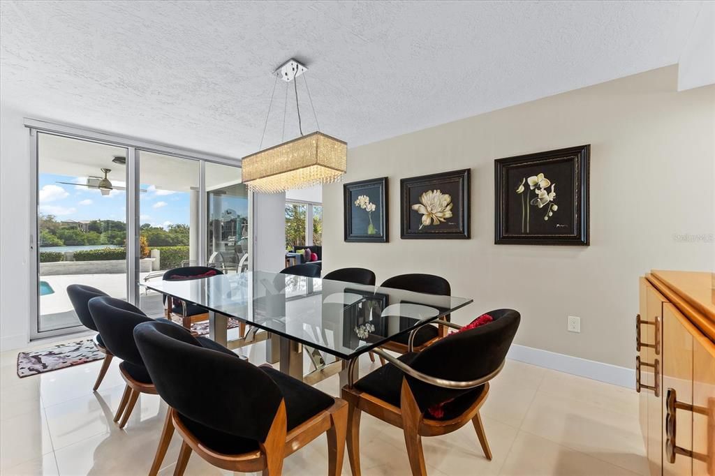 Nestled along the serene shores of Cocoanut Bayou, this captivating 4-bedroom, 4-bathroom sanctuary offers an unparalleled lifestyle for sailboat enthusiasts, boasting two boat lifts and panoramic water views.