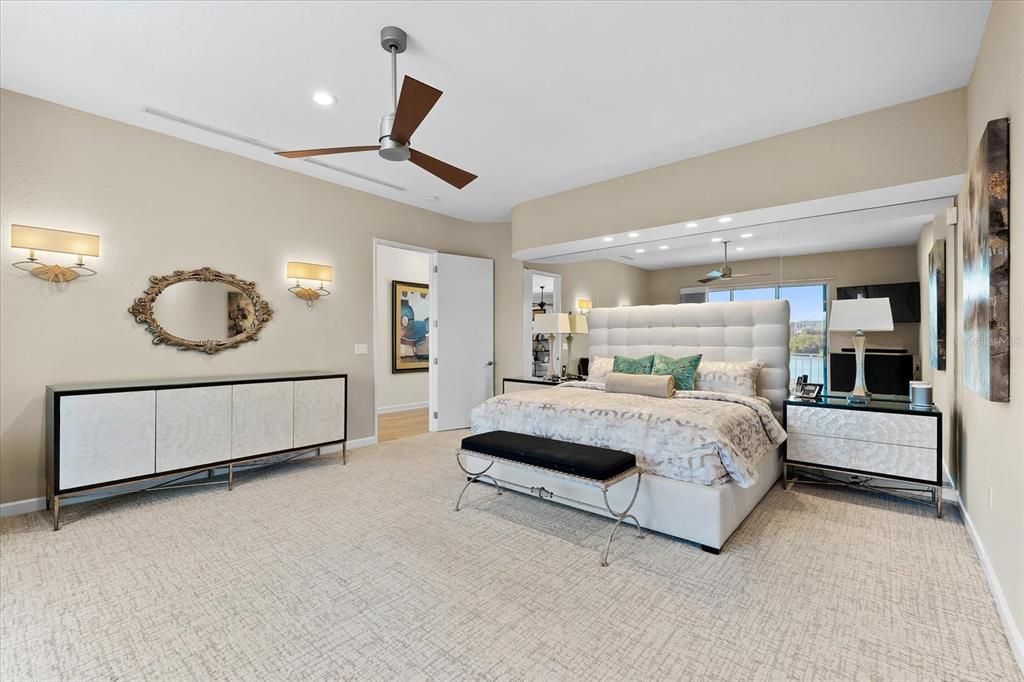 Nestled along the serene shores of Cocoanut Bayou, this captivating 4-bedroom, 4-bathroom sanctuary offers an unparalleled lifestyle for sailboat enthusiasts, boasting two boat lifts and panoramic water views.