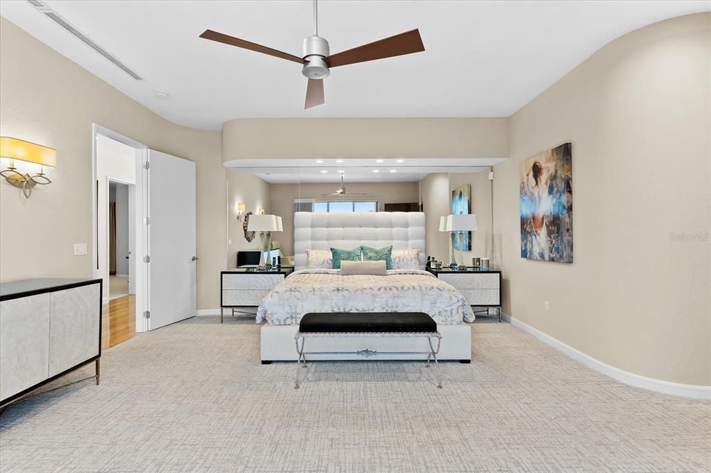Nestled along the serene shores of Cocoanut Bayou, this captivating 4-bedroom, 4-bathroom sanctuary offers an unparalleled lifestyle for sailboat enthusiasts, boasting two boat lifts and panoramic water views.