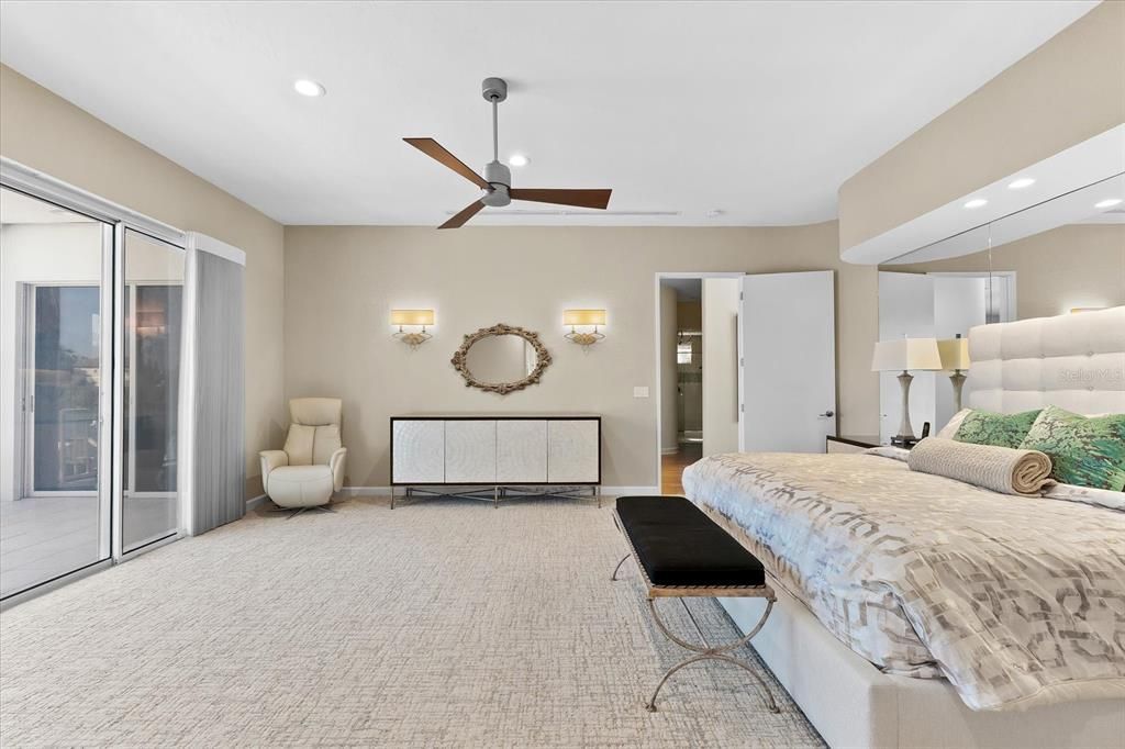 Nestled along the serene shores of Cocoanut Bayou, this captivating 4-bedroom, 4-bathroom sanctuary offers an unparalleled lifestyle for sailboat enthusiasts, boasting two boat lifts and panoramic water views.