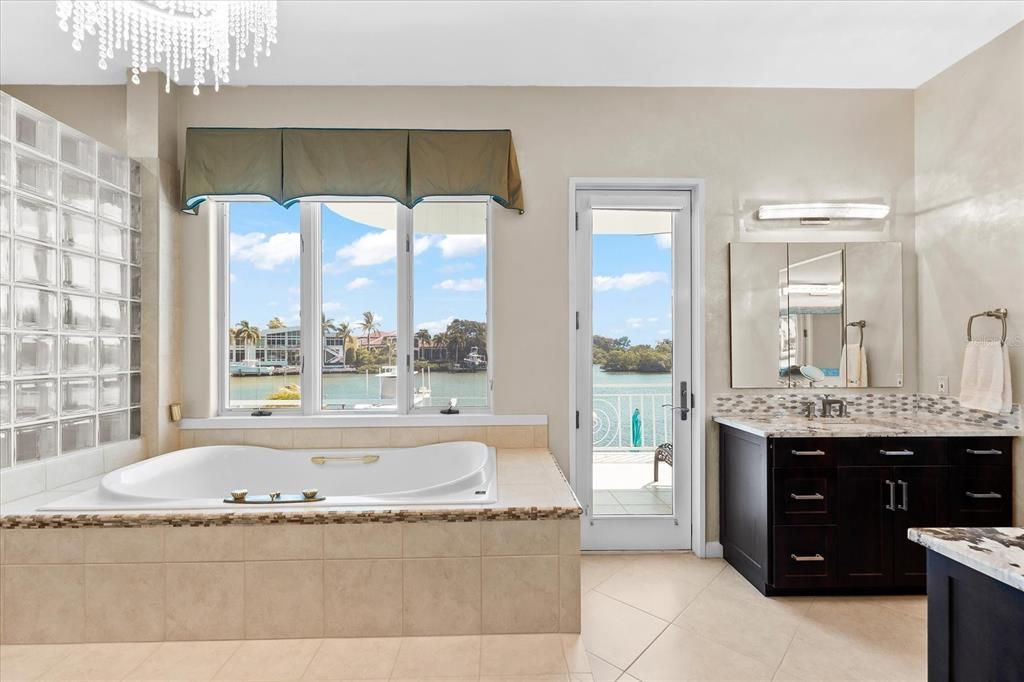 Nestled along the serene shores of Cocoanut Bayou, this captivating 4-bedroom, 4-bathroom sanctuary offers an unparalleled lifestyle for sailboat enthusiasts, boasting two boat lifts and panoramic water views.