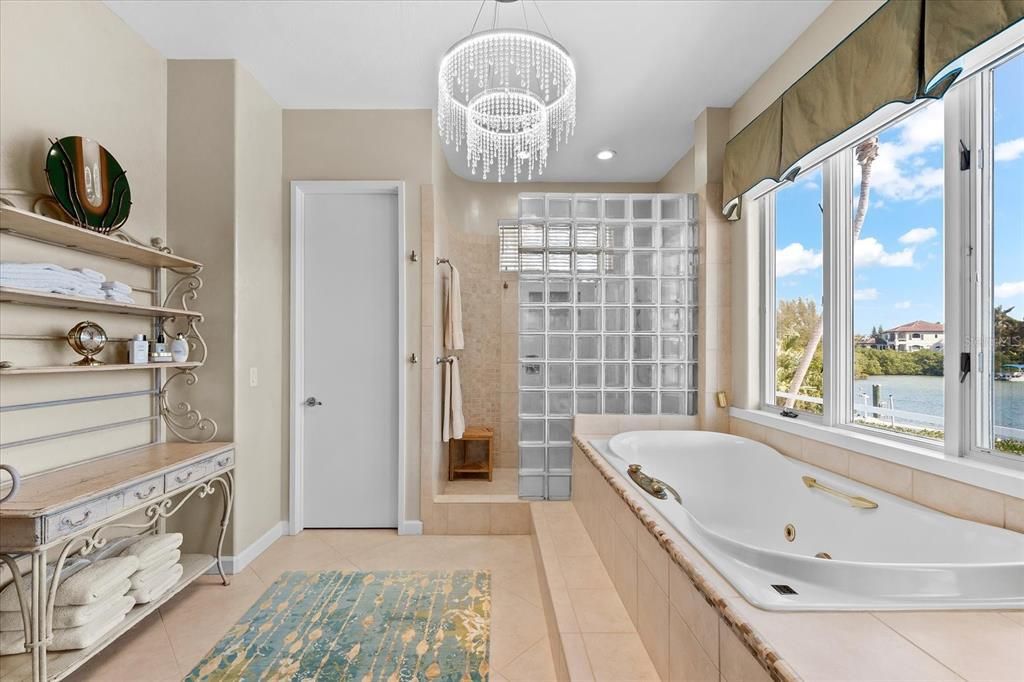 Nestled along the serene shores of Cocoanut Bayou, this captivating 4-bedroom, 4-bathroom sanctuary offers an unparalleled lifestyle for sailboat enthusiasts, boasting two boat lifts and panoramic water views.