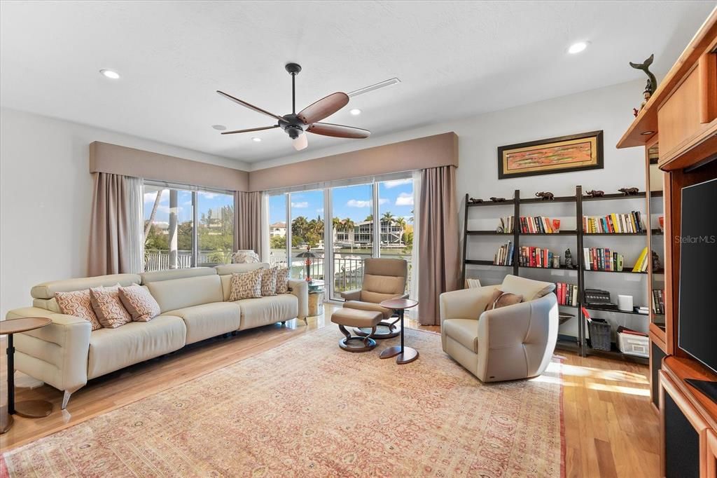 Nestled along the serene shores of Cocoanut Bayou, this captivating 4-bedroom, 4-bathroom sanctuary offers an unparalleled lifestyle for sailboat enthusiasts, boasting two boat lifts and panoramic water views.