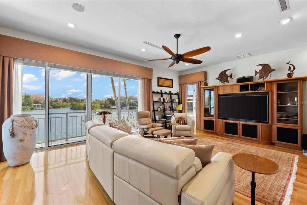 Nestled along the serene shores of Cocoanut Bayou, this captivating 4-bedroom, 4-bathroom sanctuary offers an unparalleled lifestyle for sailboat enthusiasts, boasting two boat lifts and panoramic water views.