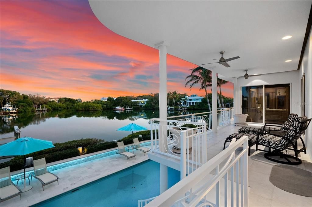 Nestled along the serene shores of Cocoanut Bayou, this captivating 4-bedroom, 4-bathroom sanctuary offers an unparalleled lifestyle for sailboat enthusiasts, boasting two boat lifts and panoramic water views.