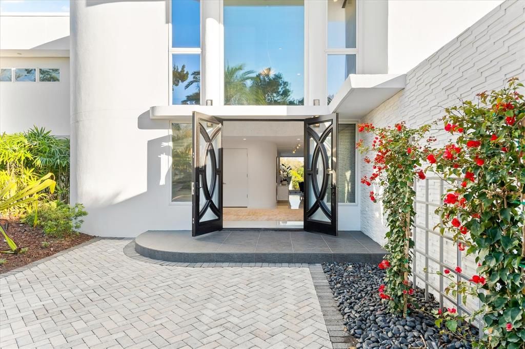 Nestled along the serene shores of Cocoanut Bayou, this captivating 4-bedroom, 4-bathroom sanctuary offers an unparalleled lifestyle for sailboat enthusiasts, boasting two boat lifts and panoramic water views.