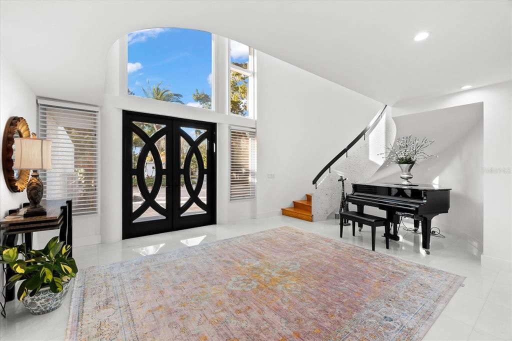Nestled along the serene shores of Cocoanut Bayou, this captivating 4-bedroom, 4-bathroom sanctuary offers an unparalleled lifestyle for sailboat enthusiasts, boasting two boat lifts and panoramic water views.