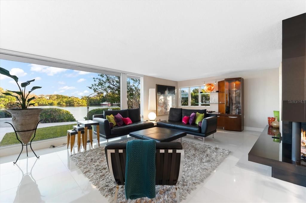 Nestled along the serene shores of Cocoanut Bayou, this captivating 4-bedroom, 4-bathroom sanctuary offers an unparalleled lifestyle for sailboat enthusiasts, boasting two boat lifts and panoramic water views.