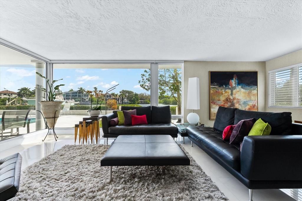 Nestled along the serene shores of Cocoanut Bayou, this captivating 4-bedroom, 4-bathroom sanctuary offers an unparalleled lifestyle for sailboat enthusiasts, boasting two boat lifts and panoramic water views.