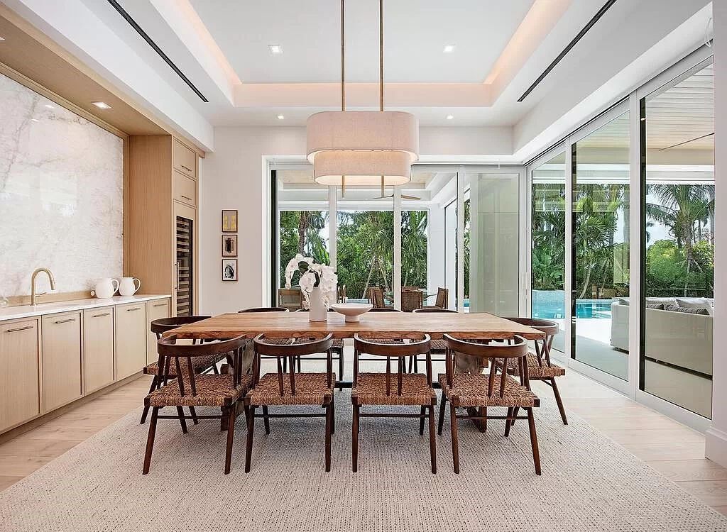 Welcome to 480 Spinnaker Dr, Naples, Florida – a newly constructed masterpiece designed by Falconer Jones, offering 6 bedrooms, 7 bathrooms, and 6,497 square feet of luxurious living space just blocks away from the Gulf of Mexico.