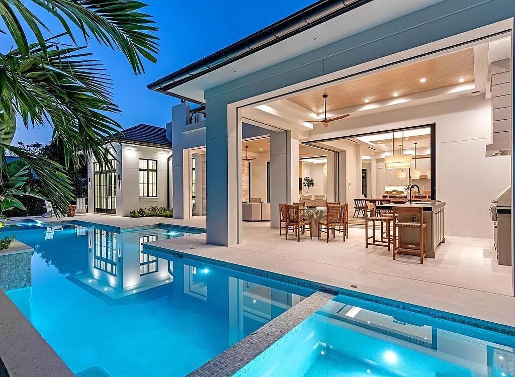 Welcome to 480 Spinnaker Dr, Naples, Florida – a newly constructed masterpiece designed by Falconer Jones, offering 6 bedrooms, 7 bathrooms, and 6,497 square feet of luxurious living space just blocks away from the Gulf of Mexico.