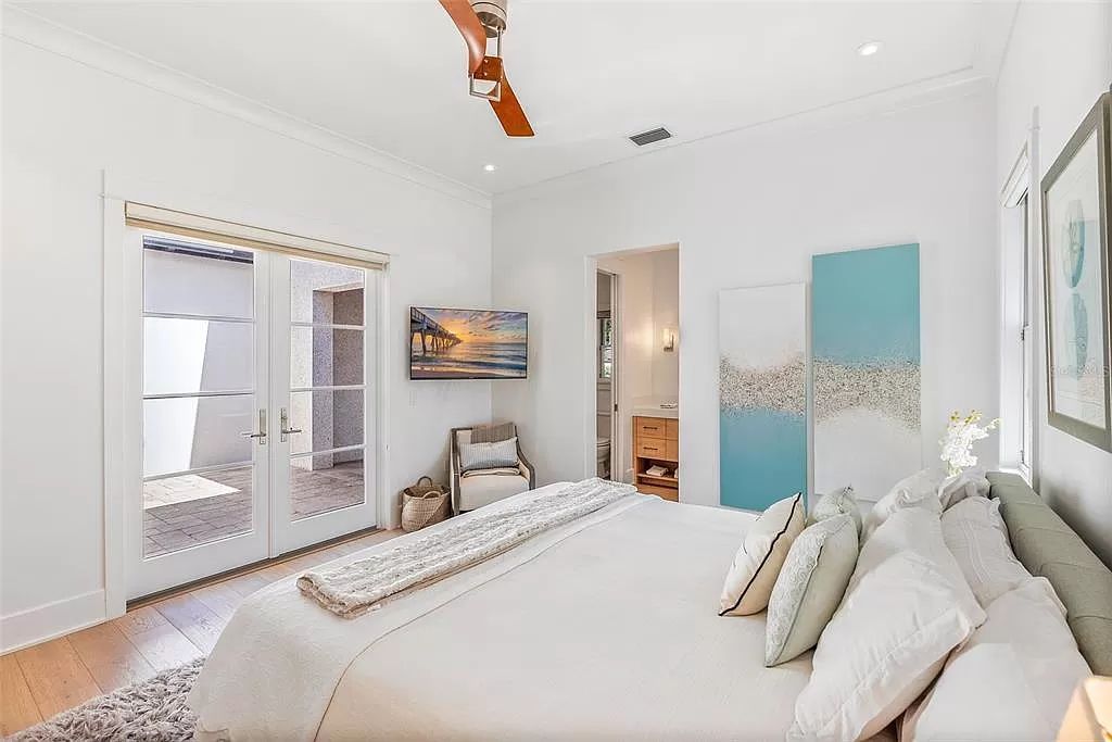 Indulge in the pinnacle of waterfront luxury living at 117 Bay Point Dr NE, Saint Petersburg, FL 33704. This exquisite property, nestled within the exclusive island enclave of Snell Isle, offers captivating ocean views from nearly every room, ensuring privacy and exclusivity among only 30 other houses.