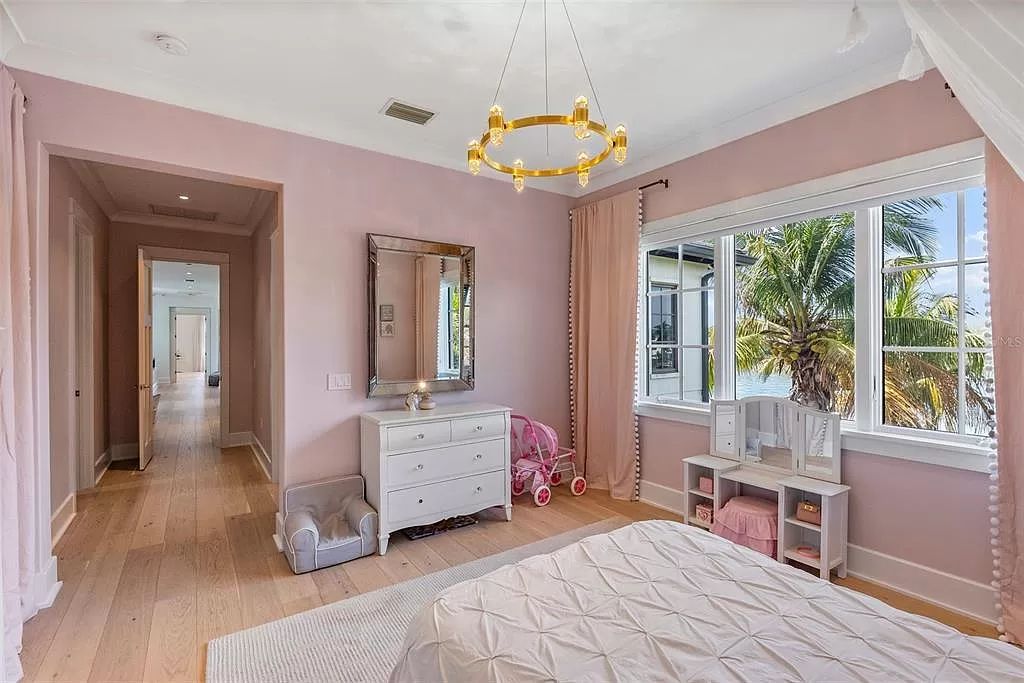 Indulge in the pinnacle of waterfront luxury living at 117 Bay Point Dr NE, Saint Petersburg, FL 33704. This exquisite property, nestled within the exclusive island enclave of Snell Isle, offers captivating ocean views from nearly every room, ensuring privacy and exclusivity among only 30 other houses.